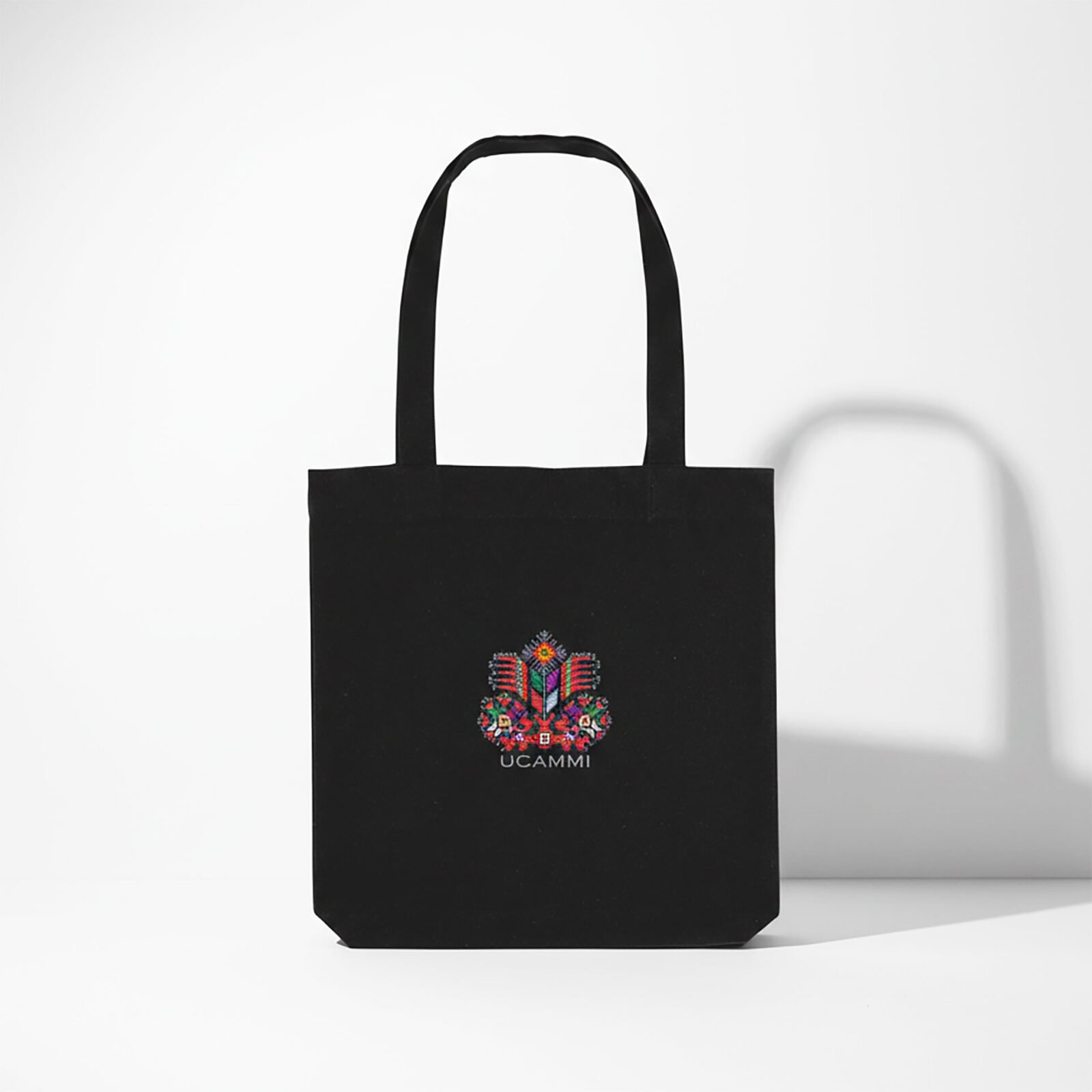 Black UCAMMI Mother Goddess embroidered tote bag front view in recycled cotton