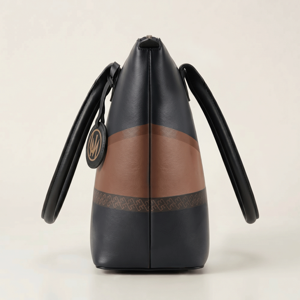 Black leather tote bag side view showing structured shape and dark printed finish