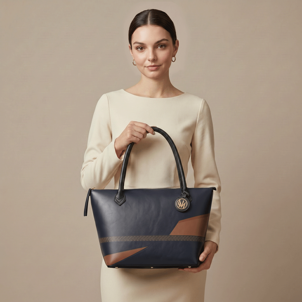 Black leather tote bag in City Noir print styled for modern everyday wear